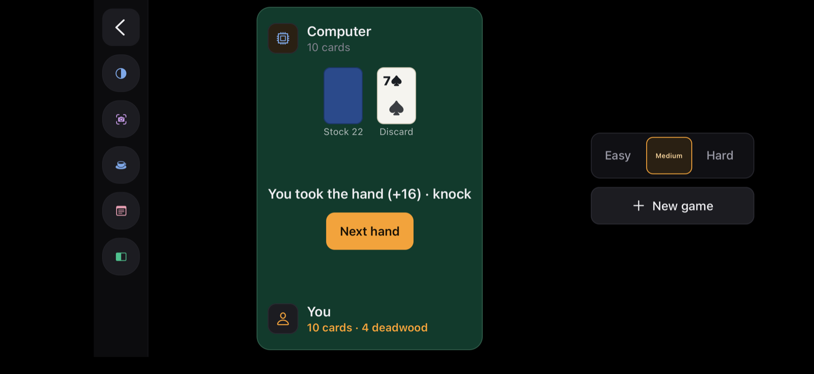 Gin rummy against the computer — the stock and discard piles and the running score.